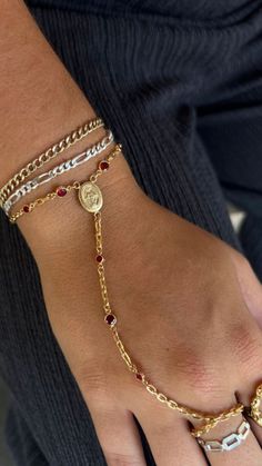 Elevate your look with this elegant permanent hand chain featuring striking red CZ stones and a radiant gold pendant. Perfect for adding a touch of sophistication to any outfit🌟 Ideal for those who love unique, standout accessories. #GoldJewelry #HandChainGoals Jewelry Statement, Chain Gold