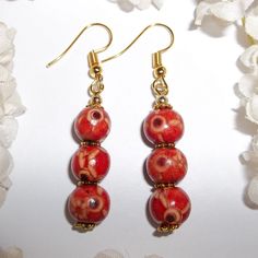 Red And Gold Wood Boho Earrings Jewelry Set Earring Earring Earring Earring 3807 Brand New And Handmade By Me - Wvluckygirl. They Have Wooden Beads That Are Red With Black And Yellow Designs On Them. They Also Have Gold Toned Costume Jewelry Beads Which Were Antiqued In Black. They Have French Fishhook Ear Wires For Her Pierced Ears. Measure 2 Inches Long And About 3/8 Inch Wide. Each Single Earring Only Weighs Approximately 1.2 Grams. Lightweight! Life Is Too Short To Wear Boring Earrings! You Red Single Earring As Gift, Single Red Earring For Gift, Single Red Earring Gift, Red Dangle Earrings With Ear Wire, Red Dangle Earrings For Pierced Ears, Red Jewelry For Pierced Ears As A Gift, Red Pierced Drop Earrings, Gift Red Beaded Earrings With Ear Wire, Red Round Bead Earrings With Ear Wire