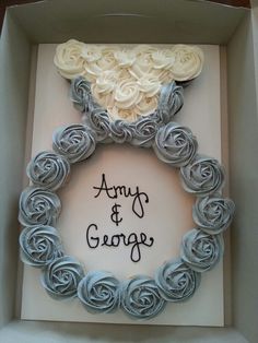 an army and george wreath made out of rolled up paper roses in a box with the words army and george written on it