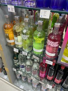 bottles of alcohol are on display in a store