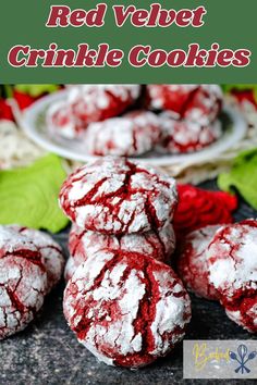 red velvet crinkle cookies are stacked on top of each other with powdered sugar