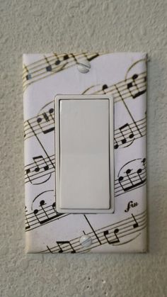 a light switch cover with musical notes on it