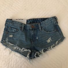 Cute Frayed/Distressed Jean Shorts. Medium To Light Wash Denim. Never Worn Casual Ripped Jeans For Beach, Casual Distressed Jeans For Beach, Summer Distressed Cutoff Jeans, Distressed Jean Shorts, Light Wash Denim, Low Rise, Jean Shorts, Urban Outfitters, Womens Shorts