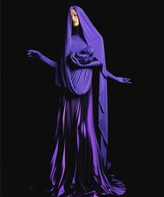 an image of a woman dressed in purple