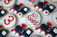 decorated cookies are arranged in the shape of trains