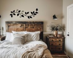 a bed sitting in a bedroom next to a wooden dresser