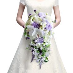 a woman in a wedding dress holding a bouquet of white and purple flowers on her arm