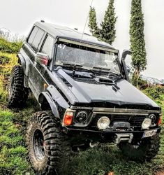 an off - road vehicle is parked in the grass