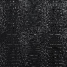 an image of black leather textured with alligator skin pattern for background or wallpaper