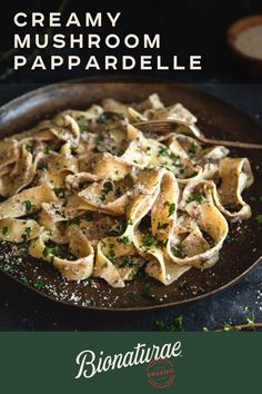 an image of a plate of pasta with parmesan cheese and herbs on it