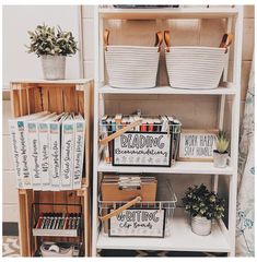 a book shelf filled with books and baskets