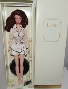 We are offering a gorgeous MIB & NRFB  "Suite Retreat Silkstone Barbie".   This gorgeous beauty has beautiful painted facial features, rosy cheeks, Blue silver eye shadow, Reddish Brown  hair, closed mouth with a deep red lip color.  She comes wearing her beautiful outfit with all accessories included.  The box is in good condition.   Take a moment to view our other wonderful and unique items we have in our shop.  We add weekly and guarantee our items. Thank you for looking. Silver Eye Shadow, Deep Red Lip, Deep Red Lips, Reddish Brown Hair, Red Lip Color, Vintage Barbies, Silkstone Barbie, Rosy Cheeks, Silver Eye