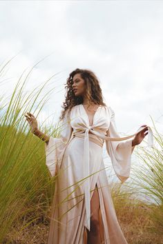 Elegant Relaxed Maxi Skirt For Brunch, Elegant Summer Maxi Skirt For Brunch, Chic Wrap Maxi Skirt With Flowy Fit, Elegant Flared Skirt For Brunch, Feminine Long Beach Skirt, Elegant Lined Maxi Skirt For Beach, Feminine Long Skirt Dress For Brunch, Feminine Maxi Skirt For Beach, Feminine Long Maxi Skirt For Brunch