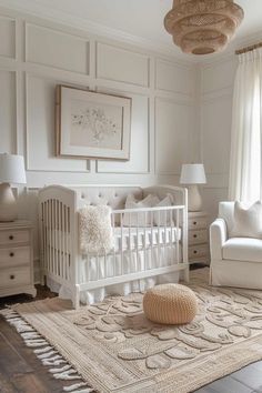 a baby's room with white furniture and decor