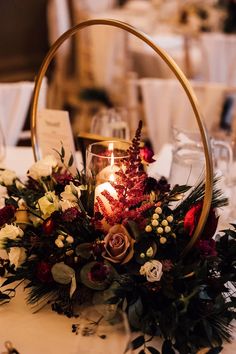 a candle is lit in the middle of a centerpiece