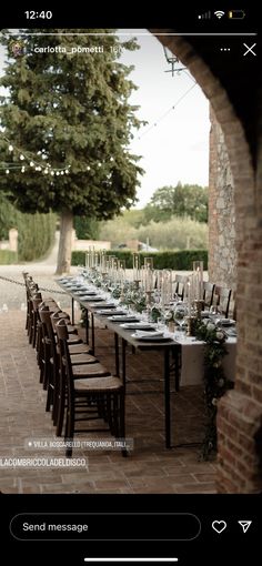 an outdoor dining table set up with place settings for the guests to sit and eat