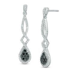 Complete your look with these sophisticated diamond drop earrings. Crafted in cool 10K white gold, each earring features a pear-shaped composite of alluring enhanced black diamonds wrapped in the shimmering embrace of a white diamond-lined frame. The white diamond ribbons extend to create the elegant twisting dangle. Radiant with 1/2 ct. t.w. of diamonds and a bright polished shine, these post earrings secure comfortably with friction backs. Round Cut Diamond Earrings, Queens Jewels, Diamond Ribbon, Peoples Jewellers, Classy Jewelry, Black Diamonds, Diamond Drops, Diamond Drop Earrings, Fine Earrings