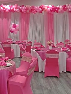 a banquet room with pink and white decor