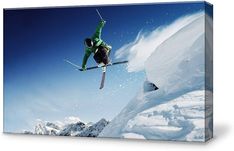 a man flying through the air while riding skis