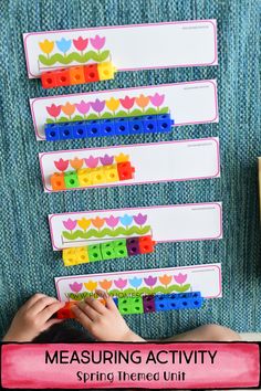 a child is playing with legos on the wall