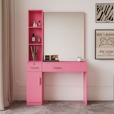 a pink desk with a mirror and shelves