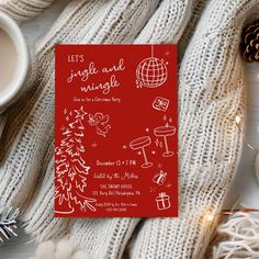 a red christmas party card on top of a white blanket next to a cup of coffee