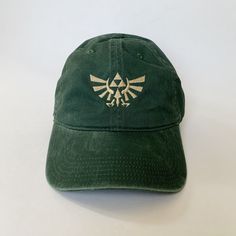 100 % Cotton.  One size fits most with an adjustable buckle strap closure. Adult / Unisex Thick ,Soft , and light material. Very nice quality built hats with quality embroidery work. Royal Crest Design, Royal Crest, Crest Design, Embroidered Hat, Dad Cap, Dad Caps, Embroidered Hats, Embroidery Work, Costume Halloween