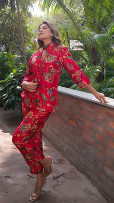 Make heads turn with out printed co-ord set in silk. Straight Pants with Blazer Jacket. Made in printed raw silk. Color : Red. Fully lined. No of Components : 2. Model height is 5.6” and is wearing a size S. Wash Care : Dry Clean Only. Casual Silk Sets With Long Sleeve, Casual Silk Long Sleeve Sets, Red Printed Loungewear Set, Festive Long Sleeve Loungewear Pant Set, Printed Silk Sets With Long Sleeves, Long Sleeve Sets With Printed Motifs For Loungewear, Traditional Red Printed Sets, Red Printed Festive Sets, Red Long Sleeve Set With Printed Motifs