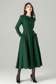 "Green long sleeve wool swing dress with a stylish folded neckline. This dress effortlessly blends elegance and comfort. The flared silhouette offers a graceful and flattering fit, while the high-quality wool fabric ensures warmth and softness. The folded neckline adds a touch of sophistication to this versatile dress, perfect for various occasions. DETAIL * 30% wool, 30% fiber, 40% polyester * fully satiny lining, more nice to the touch body * Round pleated neckline * Long sleeves * Fit and fla Formal Dresses For Fall, Long Sleeve Pleated Wedding Dress, Chic Pleated Long Sleeve Dress For Winter, Fall Wedding Pleated Dress, Fall Wedding Dress With Pleated Details, Classic Wool A-line Dress, Solid Color A-line Long Sleeve Dress For Fall, Elegant Wool A-line Dress, Winter Party Pleated Long Sleeve Dress