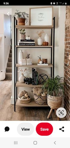 an image of a book shelf with plants on it