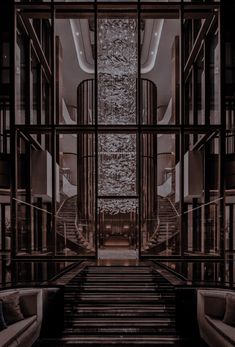 an empty lobby with stairs leading up to the second floor