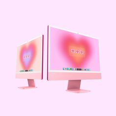 two computer monitors with heart images on the screen are shown in pink and red colors