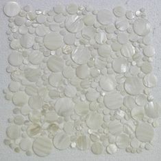 white shell mosaic tile in the shape of circles and dots on a white background, suitable for