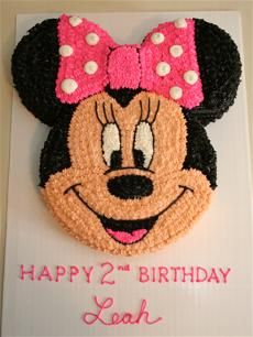 a birthday cake with a minnie mouse on it's face and the words happy 2nd birthday