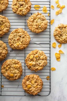 freshly baked oatmeal cookies cooling on a wire rack with orange zest