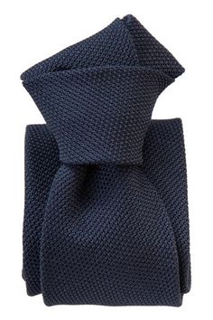 Embrace classic elegance with this dark navy grenadine tie that will give your look understated sophistication and will make a lasting impression. Standard Length: Approx. 3.25" x 58.5". A classic tie width and length that is perfect for most men up to 6'2". 100% silk grenadine garza fina: Garza fina (fine gauze) is a loose weave fabric made from high-twist yarns. It has a slightly knobby texture. Tipped with our signature pinstripe silk: Not only is it a refined finishing touch, it keeps your t Luxury Standard Necktie, Semi-formal Navy Standard Tie, Grenadine Tie, Elegant Blue Cotton Ties, Luxury Blue Neckwear With Ties, Luxury Navy Standard Tie, Tie For Men, Weave Fabric, Man Up