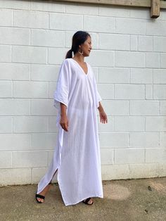 Unwind in absolute comfort with our semi sheer cotton gauze kaftan. This kaftan is perfect for the beach, pool, resort and laid-back time at home. Crafted from quality soft and breathable gauze cotton, it offers an airy fit that's ideal for lounging and cover up. Its relaxed design and easy slip-on style make it your go-to choice for outdoor cover up and relaxed nights at home. Oversized White Cover-up For Loungewear, White Relaxed Fit Cover-up For Loungewear, Beachy V-neck Cover-up With Relaxed Fit, Relaxed Fit Vacation Cover-up, White Summer Cover-up With Relaxed Fit, Relaxed Fit Beach Dress, White Relaxed Fit Summer Cover-up, Summer Maxi Length Cover-up For Loungewear, Long Relaxed Fit Beachwear Cover-up