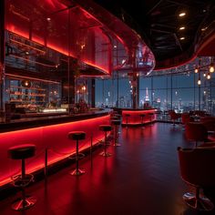 a dimly lit bar with red lighting and stools in front of the window at night