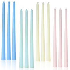 five different colored candles lined up in a row