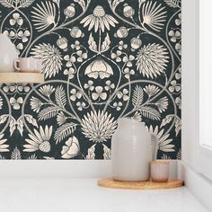 a black and white wallpaper with flowers on it