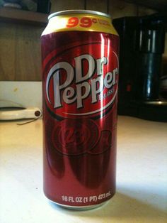 a can of soda sitting on top of a counter