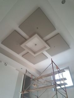 an unfinished ceiling with scaffolding on it