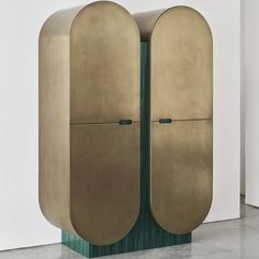 a tall metal cabinet with two doors on it's sides