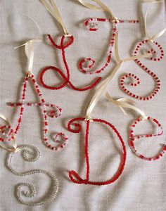 red and white beaded medical ornament ornaments on a tablecloth with ribbon