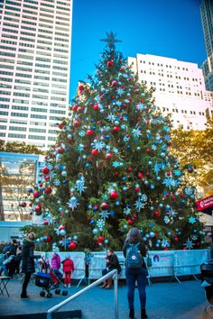 a large christmas tree in the middle of a city