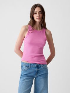 Soft cotton-blend ribbed knit tank top.  Halter neckline.  Sleeveless.  * Fit: Classic.  A straight & easy fit.  Hits at the hip.  Models wearing Gap Trendy Fitted Tank Top From Gap, Trendy Gap Tank Top For Spring, Trendy Fitted Tank Top By Gap, Gap Stretch Tank Top For Spring, Pink Fitted Tank Top For Everyday, Gap Sleeveless Tops For Everyday Wear, Sleeveless Gap Tops For Everyday, Sleeveless Everyday Tops By Gap, Versatile Pink Tank Top