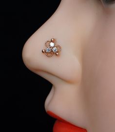 Product Detail : - Material : - 925 Sterling silver, Cubic zirconia gem stone with Rose Gold Plated,nickle free Plating Color : - Rose Gold Stone Color: - White (as per Image) Width :- 4 mm Length : - 4 mm Wire Gauge size : - 22 Gauge / 0.62 mm 20 Gauge / 0.80 mm 18 Gauge / 1.00 mm 16 gauge / 1.2 mm Shipping Detail: Processing Time : - 1-2 Working Day Shipping Time : - 15-20 Working days Shipping Service : - USPS,DHL eCommerce,UPS and FedEx. Note :- 1) For Express shipping ( 3-5 Working days ) p 14k Rose Gold Nose Rings As Gift, Elegant Hypoallergenic Nose Rings For Weddings, Elegant Nickel-free Round Nose Rings, Hypoallergenic Nose Rings For Wedding, Nose Stud Indian, Silver Nose Stud, Nose Screw, Indian Nose Ring, Wire Gauge