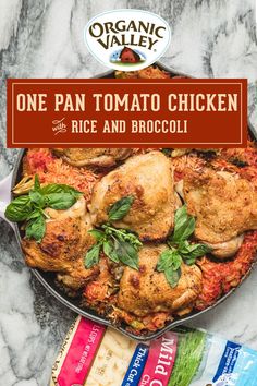 one pan tomato chicken with rice and broccoli in a skillet on a marble counter top