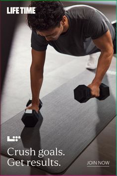 a man lifting two dumbs on top of a gym mat with the words crush goals get results