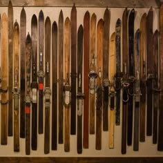 there are many skis lined up on the wall